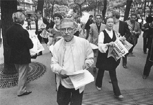 Jean-Paul Sartre and Simone de Beauvoir defying a government ban by illegally distributing La Cause du Peupl e in the spring of 1970. Photo: Gilles Peress. Source: Magnum Photo.